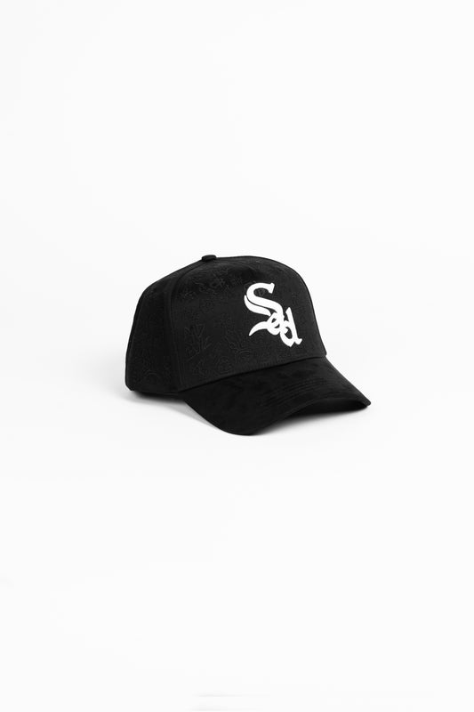 Black cap with a white logo on a white background