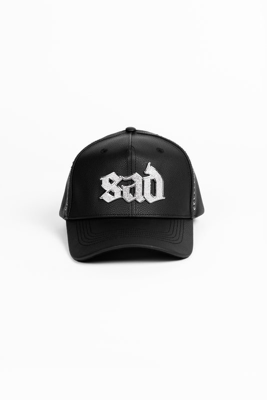 Black cap with white text on a white background